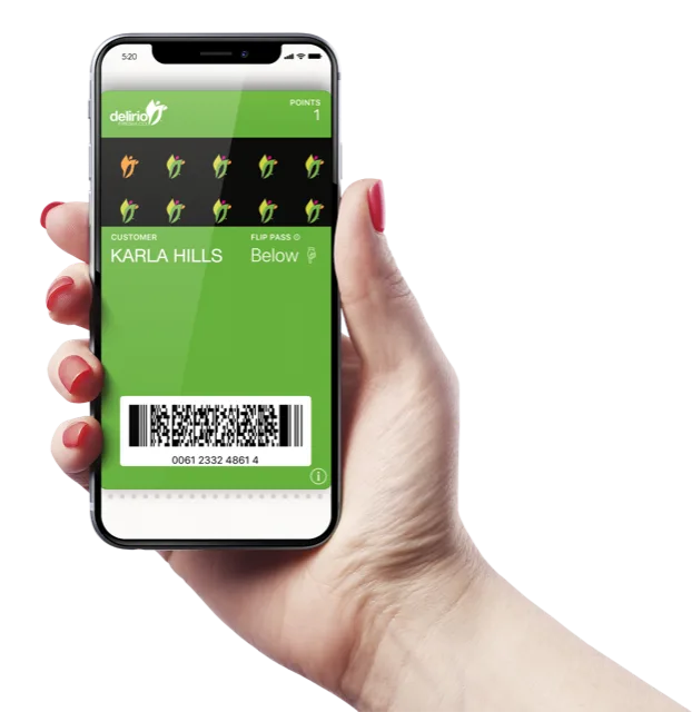 A hand holding a phone that shows a green loyalty card with a stamp grid and a barcode in the wallet.
